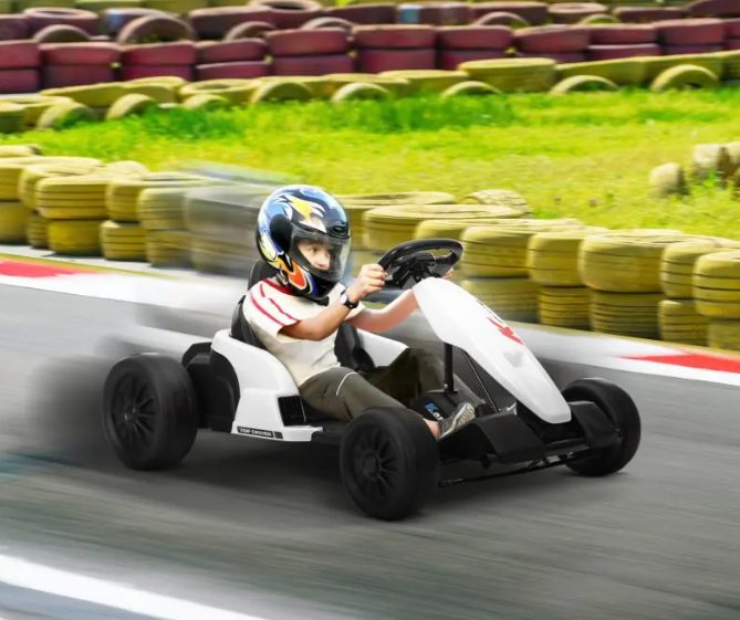 A child is riding the kids go kart.